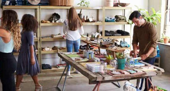 Clothing boutique filled with customers browsing