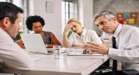 Man being brought in to a meeting because a co-worker told lies about him